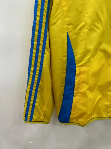 Giacca a vento reversibile blu e gialla Arsenal 25-26