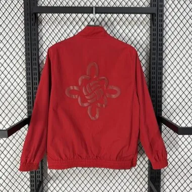 Casaco reversível do Manchester United 2026/27, preto e vermelho, para o Ano Novo