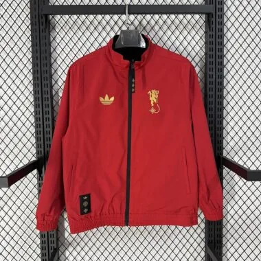 Casaco reversível do Manchester United 2026/27, preto e vermelho, para o Ano Novo