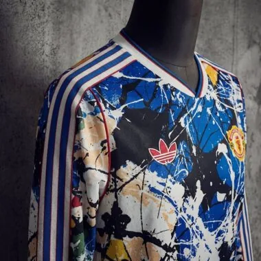 Camiseta de manga larga del Manchester United 2025/26 con marca compartida (tallas S-4XL)