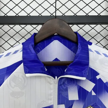 Veste coupe-vent réversible bleu et blanc du Real Madrid, 24-25